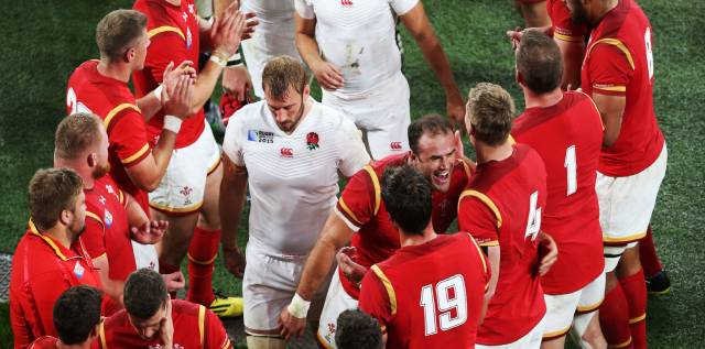 Jamie Roberts celebrates the Welsh victory in front of dejected England captain Chris Robshaw.